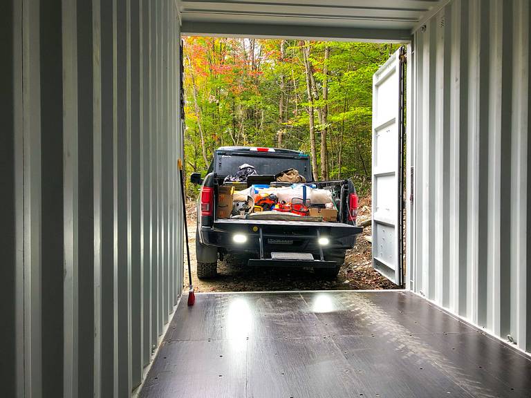 Unloading Truck Bed Shipping Container