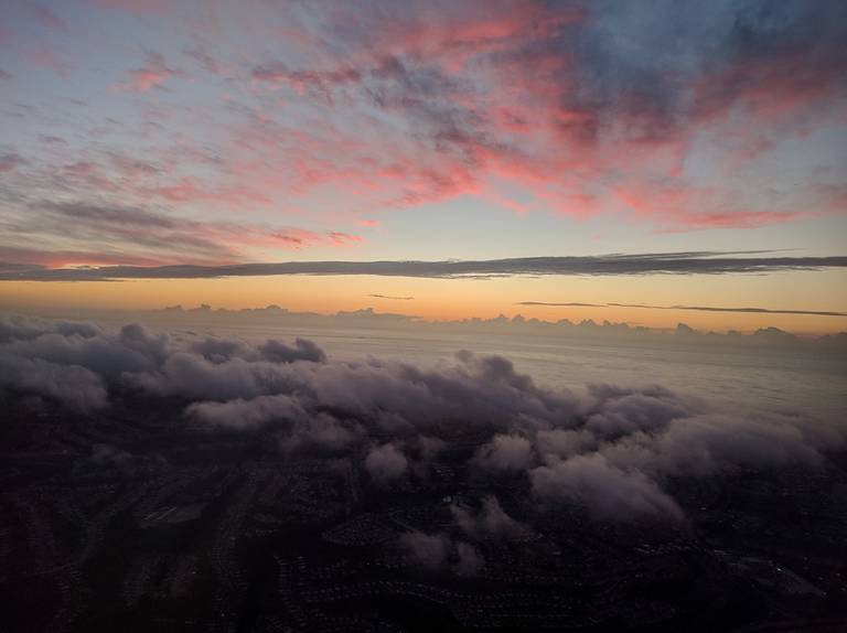 Clouds colored in red and yellow by the sunset.