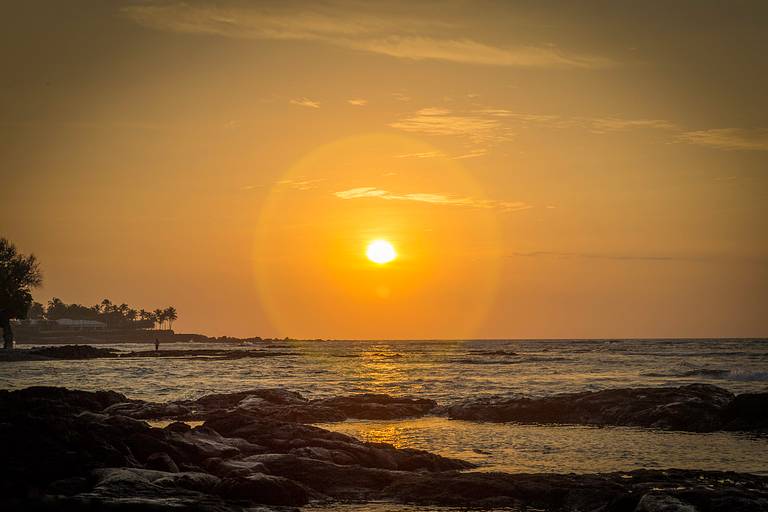 Hawaii sunset in yellow and orange tones.