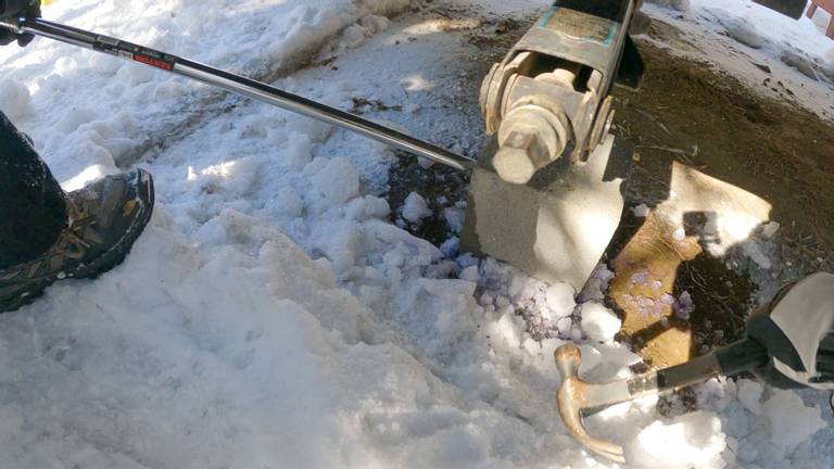 Concrete Block Frozen on Ground